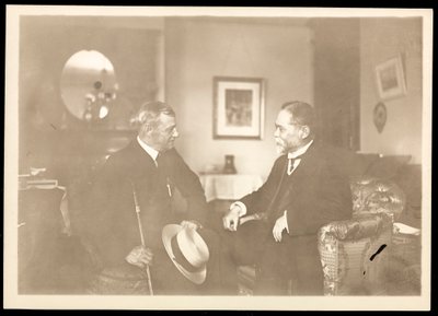 Rear Admiral Robley Dunglison Evans seated with another man by Byron Company